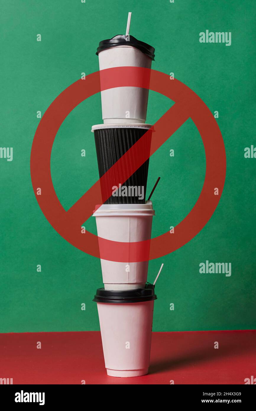 Stop using singleuse plastic. A pile of plastic coffee cups with