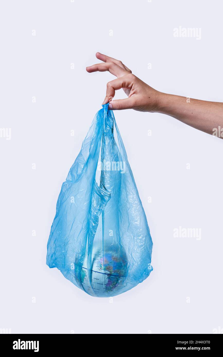 Global Warming and Climate Change concepts. Woman hand holds a glove in