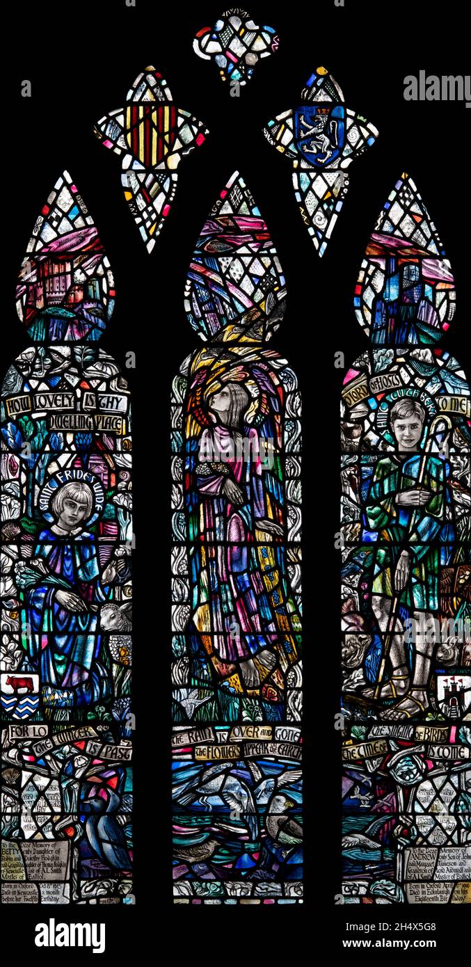 The  sad but cheerful A. L. Smith commemorative window in St Aidan's church, Bamburgh, Northumberland, UK Stock Photo