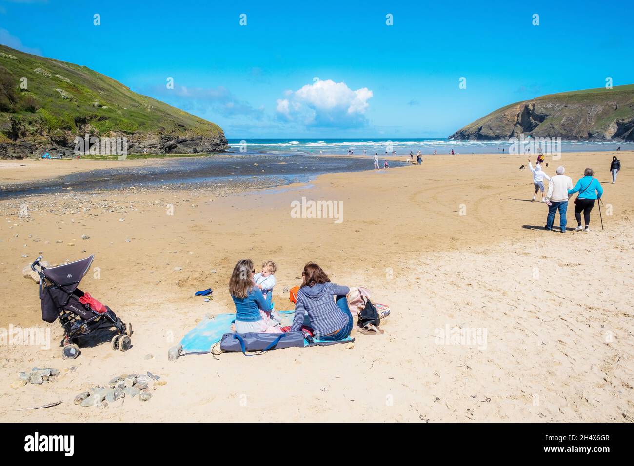 Mawgan Porth beach in Cornwall; holidaymakers enjoying the sunshine on a Cornish staycation beach holiday in the UK. Stock Photo