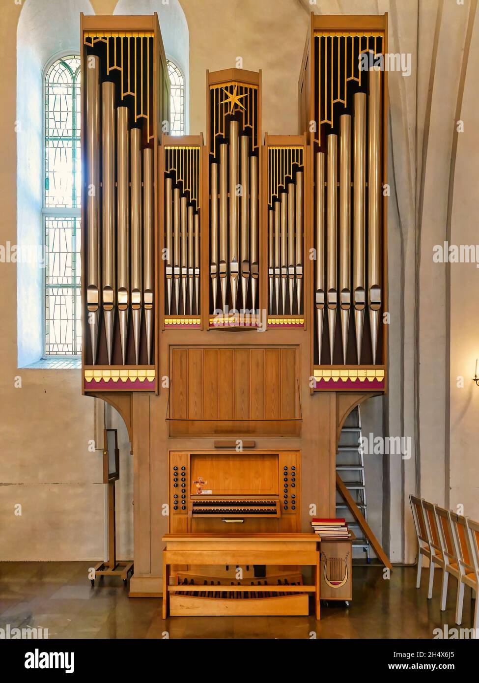 large church pipe organ keyboard music instrument interior church Stock Photo