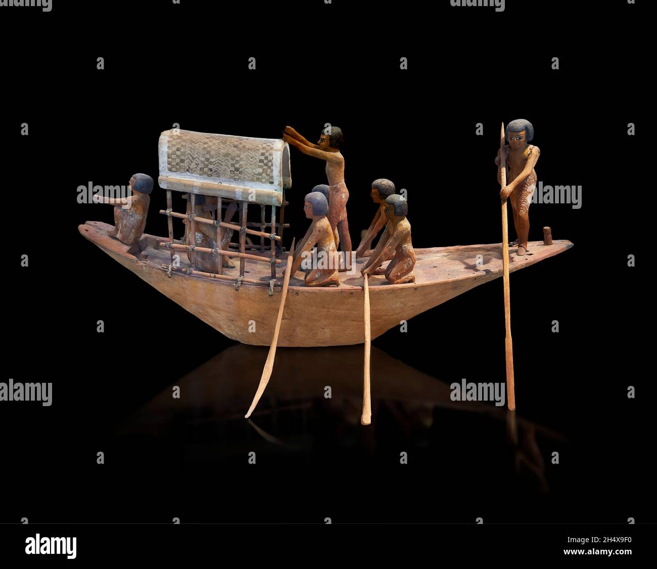 Wooden Egyptian wood boat model, 2106 -1786 BC, Archaic or Early Dynastic Period  Louvre Museum inv E 284 or N1616. Navigation scene boat equipped wit Stock Photo