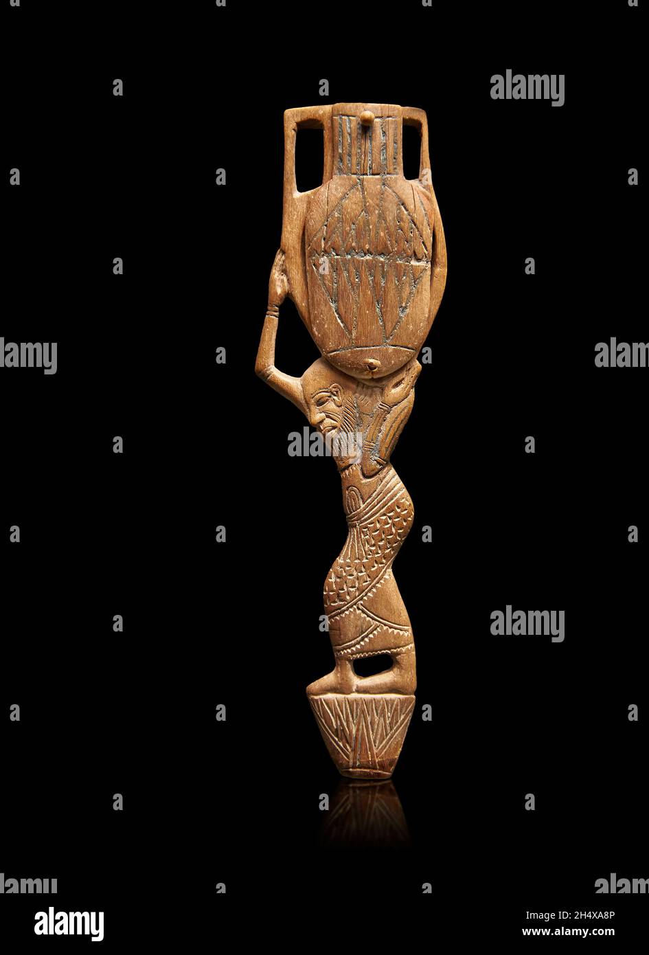 Shdo Spoon Ancient Egyptian wood cosmetic shadow spoon of a servant carrying an ...