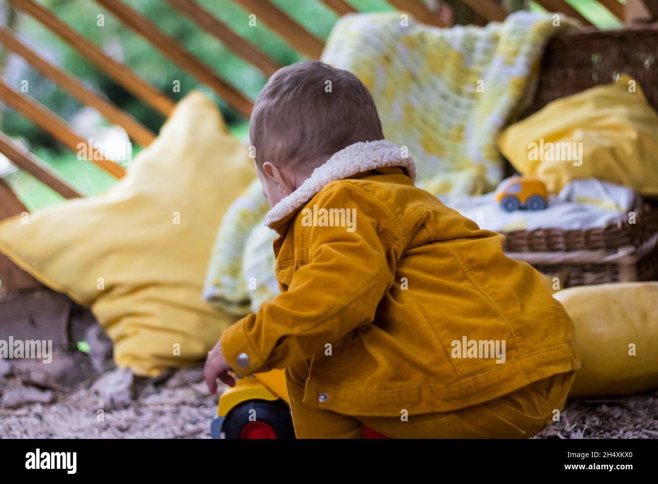 Closeup shot of a caucasian baby playing in the garden Stock Photo - Alamy