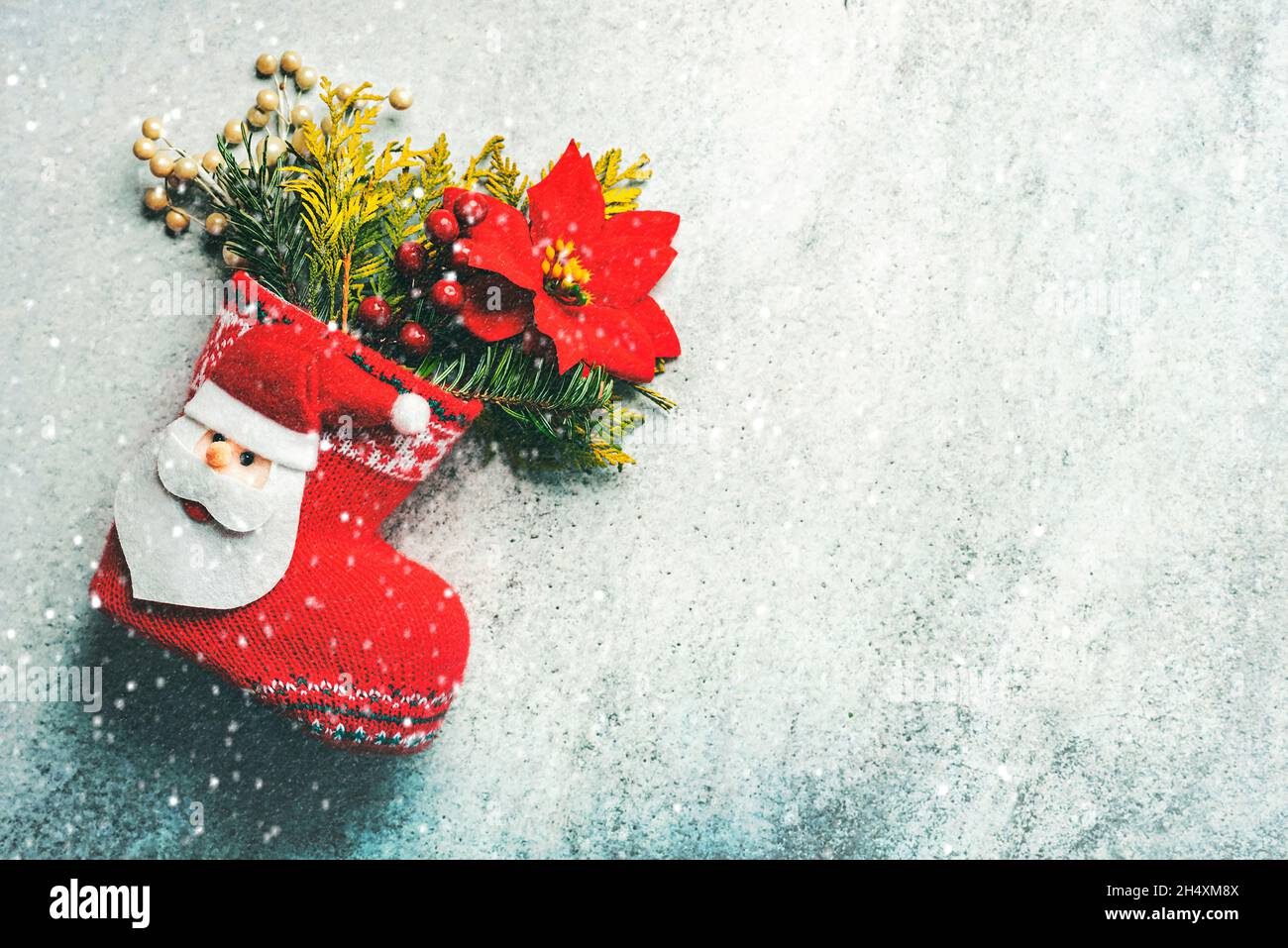 Merry Christmas. Christmas stocking with Christmas decoration and snowflakes with copy space over grunge background. Christmas concept background Stock Photo