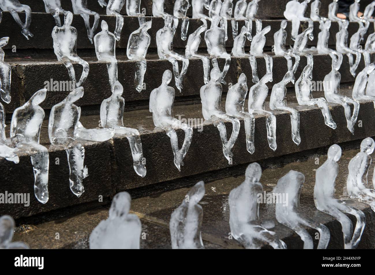 For the first time in Great Britain, Brazilian artist Nele Azevedo creates a breathtaking display of over 5,000 figures made out of ice on 2nd August at Chamberlain Square - Birmingham Stock Photo