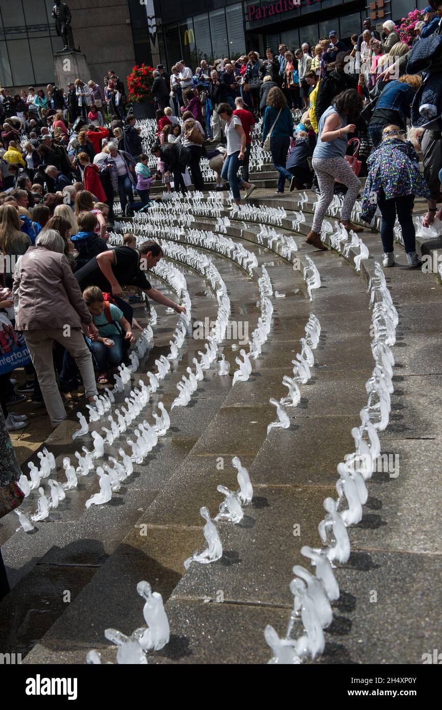 For the first time in Great Britain, Brazilian artist Nele Azevedo creates a breathtaking display of over 5,000 figures made out of ice on 2nd August at Chamberlain Square - Birmingham Stock Photo