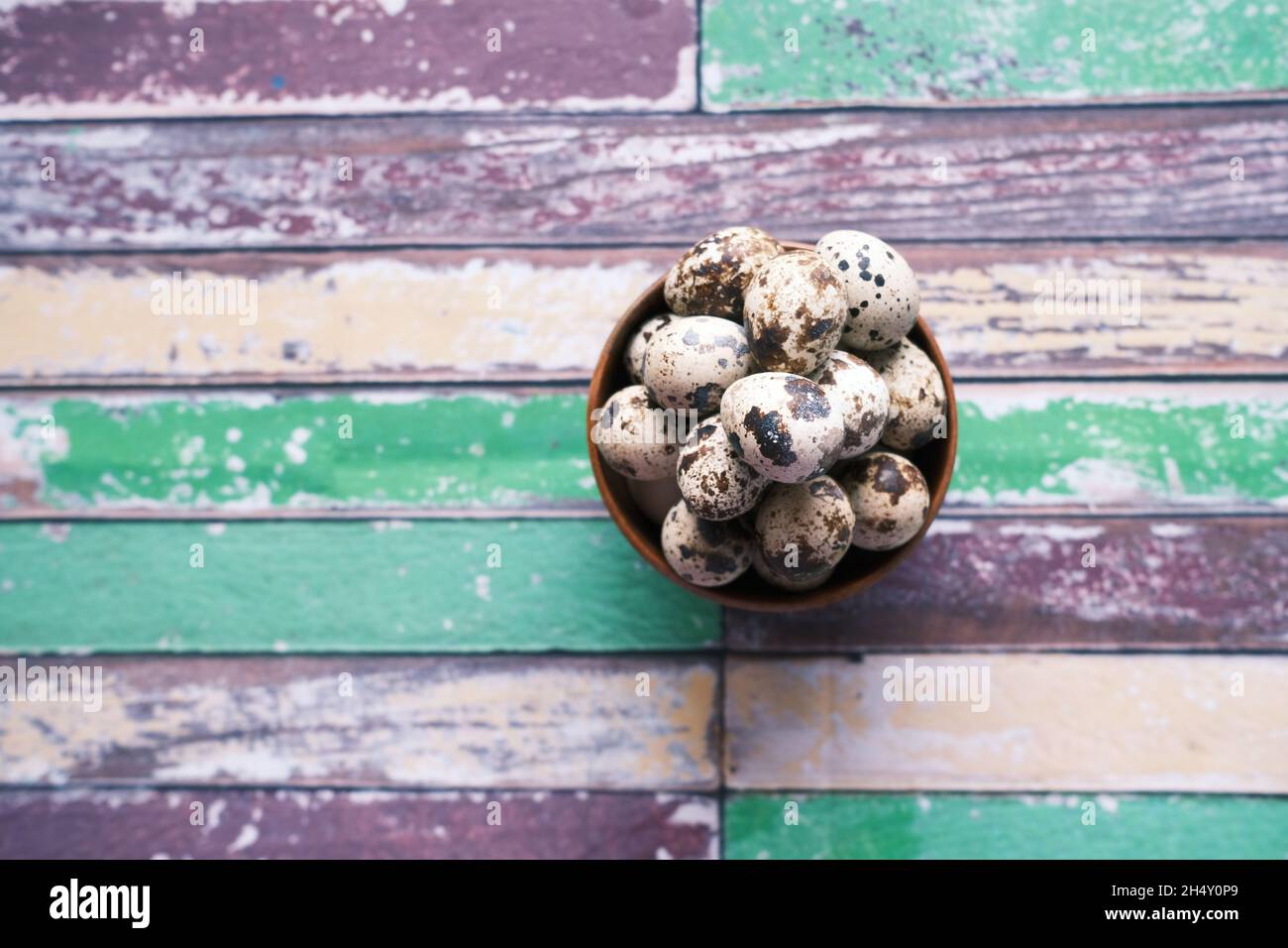 Quails eggs in a bowl on table top view  Stock Photo