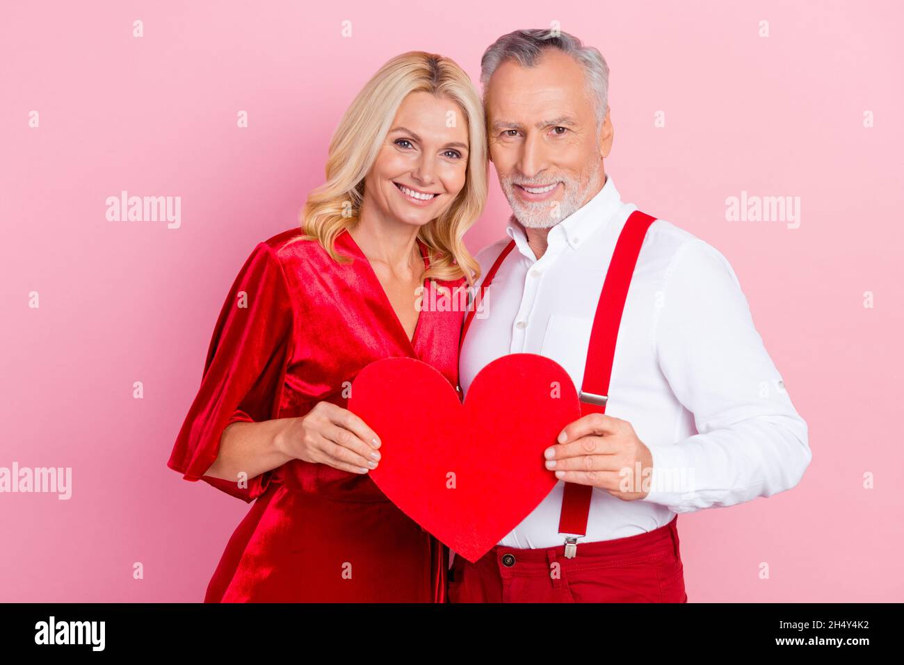 Two Spouses Portrait of two beautiful handsome tender spouses bonding holding heart ...