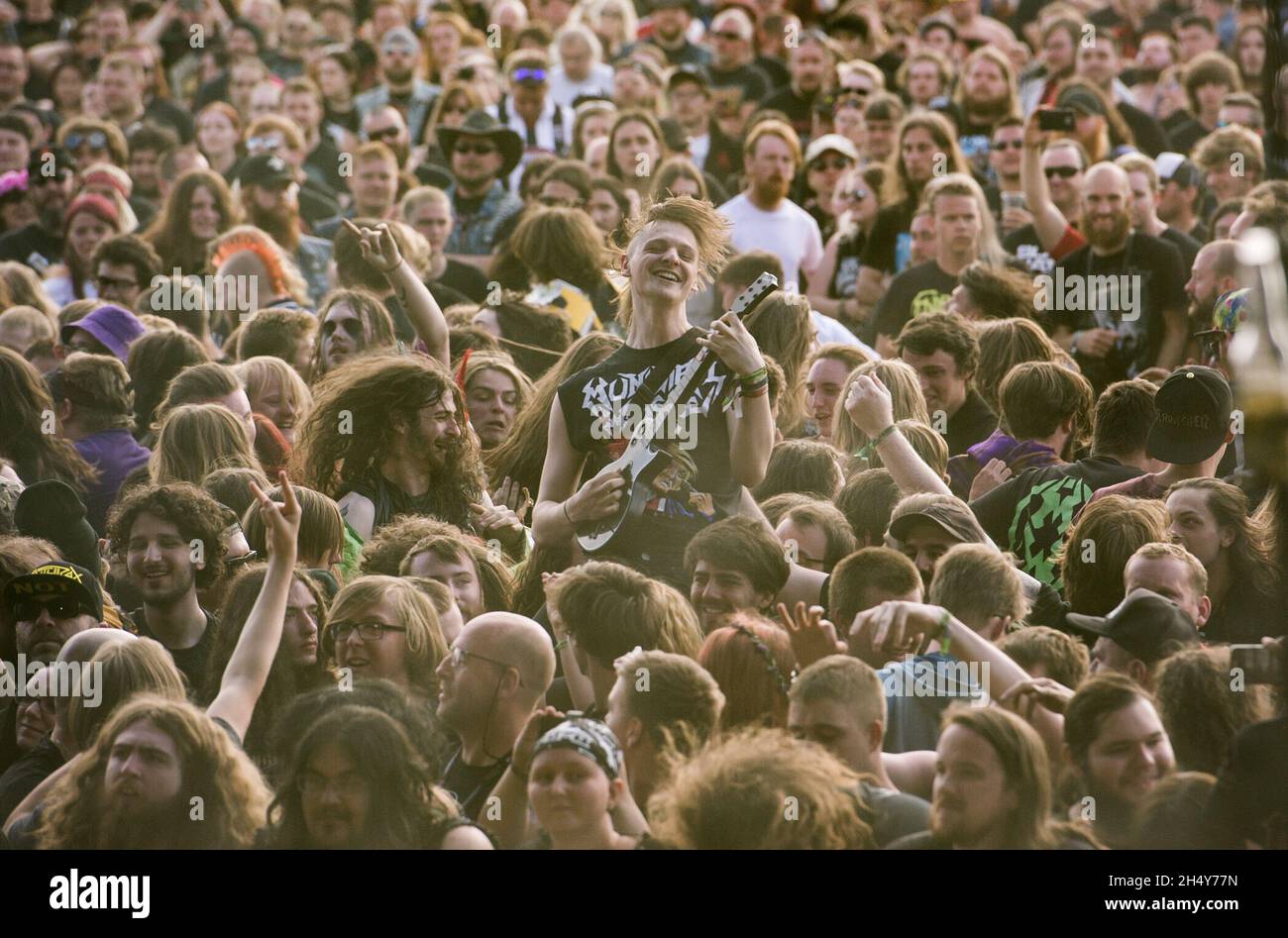 Crowd surfers at Bloodstock festival on August 14 2016 at Catton Hall, United Kingdom. Stock Photo