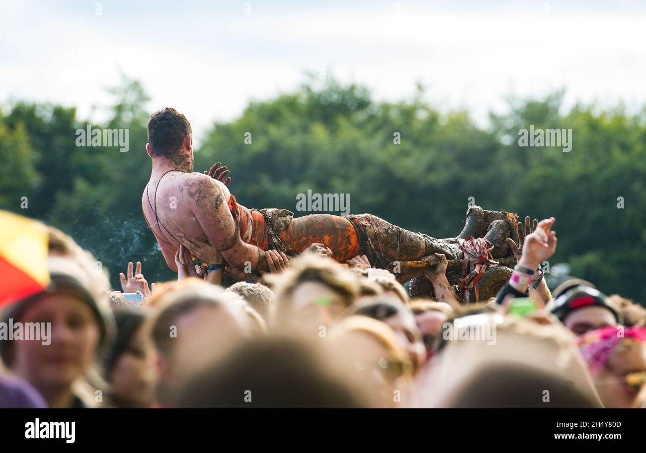 A man strapped on a trolley crowdsurfing at Leeds Festival 2016 at Bramham Park, UK. Picture date: Sunday August 28, 2016. Photo credit: Katja Ogrin/ EMPICS Entertainment. Stock Photo