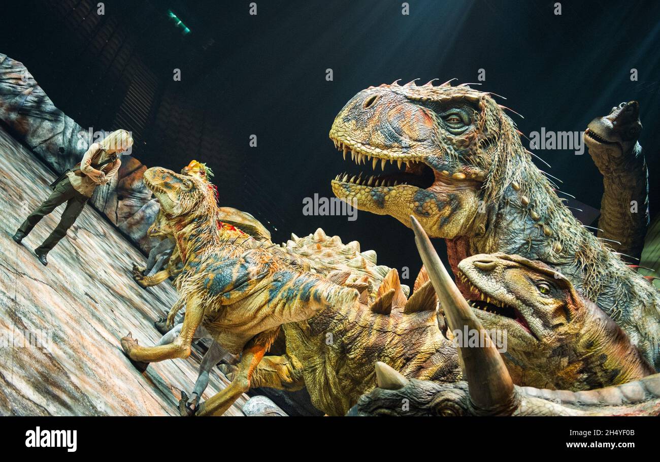 Michaela Strachan as â€˜Huxleyâ€™ the Palaeontologist poses with dinosaurs during photocall for Walking with Dinosaurs â€“ The Arena Spectacular at Arena Birmingham  on July 26, 2018 in Birmingham, England. Picture date: Thursday 26 July, 2018. Photo credit: Katja Ogrin/ EMPICS Entertainment. Stock Photo