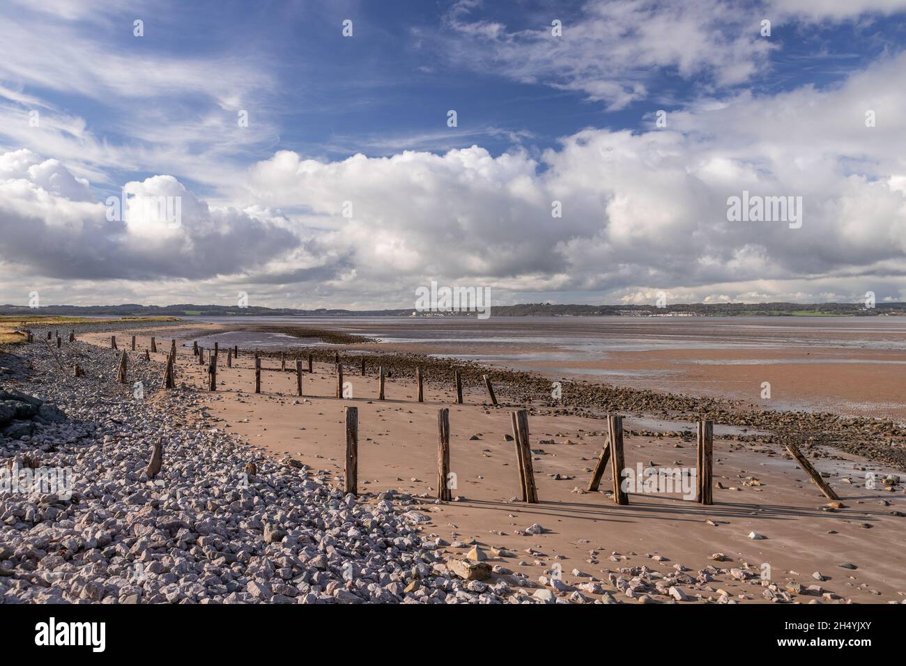Beach with groynes at Llanfairfechan, North Wales coast Stock Photo