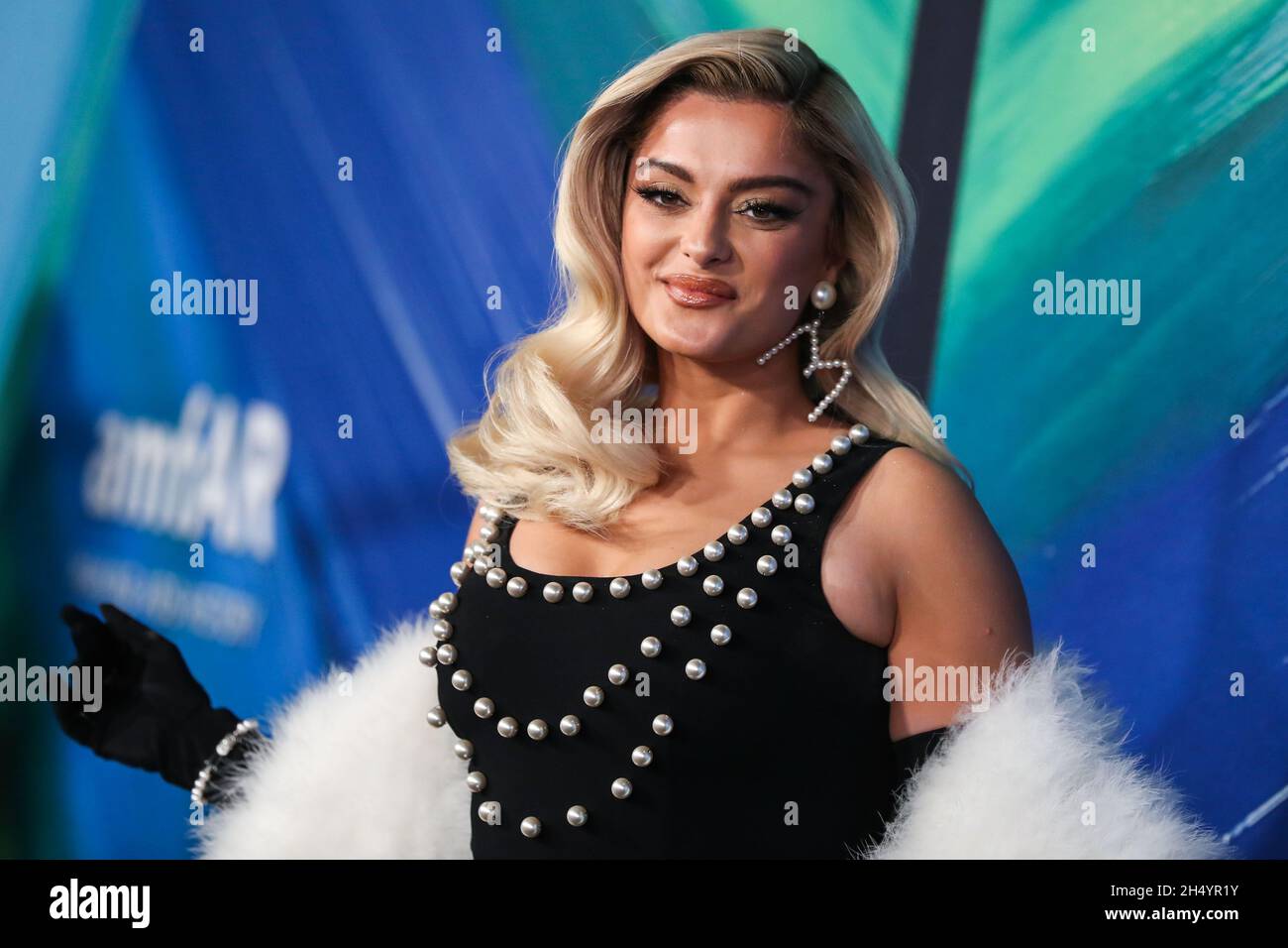 WEST HOLLYWOOD, LOS ANGELES, CALIFORNIA, USA - NOVEMBER 04: Singer Bebe Rexha wearing a Moschino dress arrives at the amfAR Gala Los Angeles 2021 honoring TikTok and Jeremy Scott held at the WEST HOLLYWOOD, LOS ANGELES, CALIFORNIA, USA - NOVEMBER 04: Singer Bebe Rexha wearing a Moschino dress arrives at the amfAR Gala Los Angeles 2021 honoring TikTok and Jeremy Scott held at the