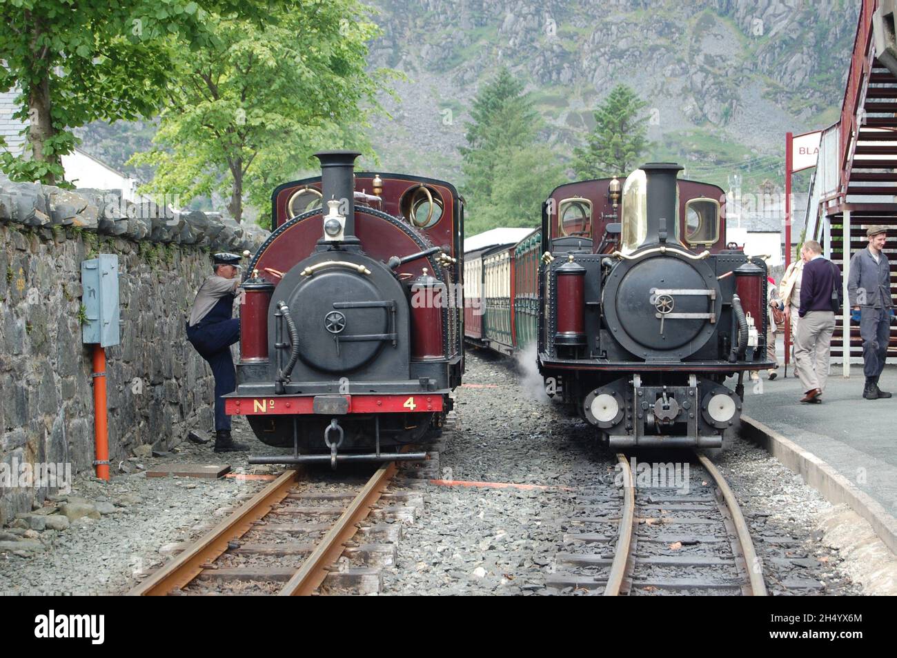 A train driver embarking on a steam train on the Ffestiniog railway, in