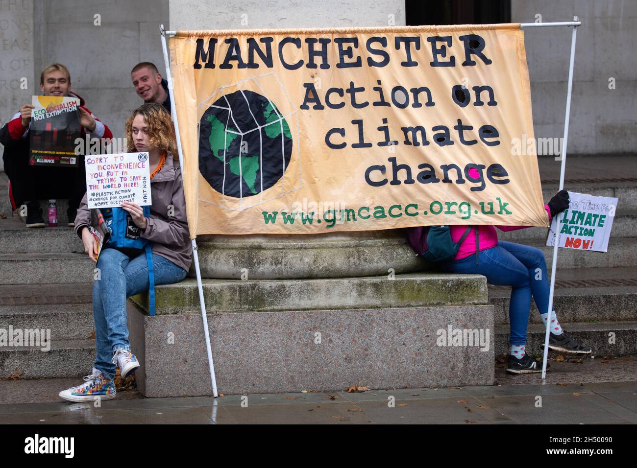 Youth Climate Strike. St Peter's Square , Manchester, United Kingdom. The protest was held at  St Peters square( the site of the Peterloo massacre in 1819 which saw industrial workers protest during the industrial revolution). Young people gathered to Protest across the world to demand a radical action on climate change and climate justice. Days of protest are planned across Manchester and around the globe during COP 26 being held in Glasgow UK . Climate change is already destroying the lives of millions of people. 2021 has seen floods and hurricanes to some of the biggest wildfires in history Stock Photo