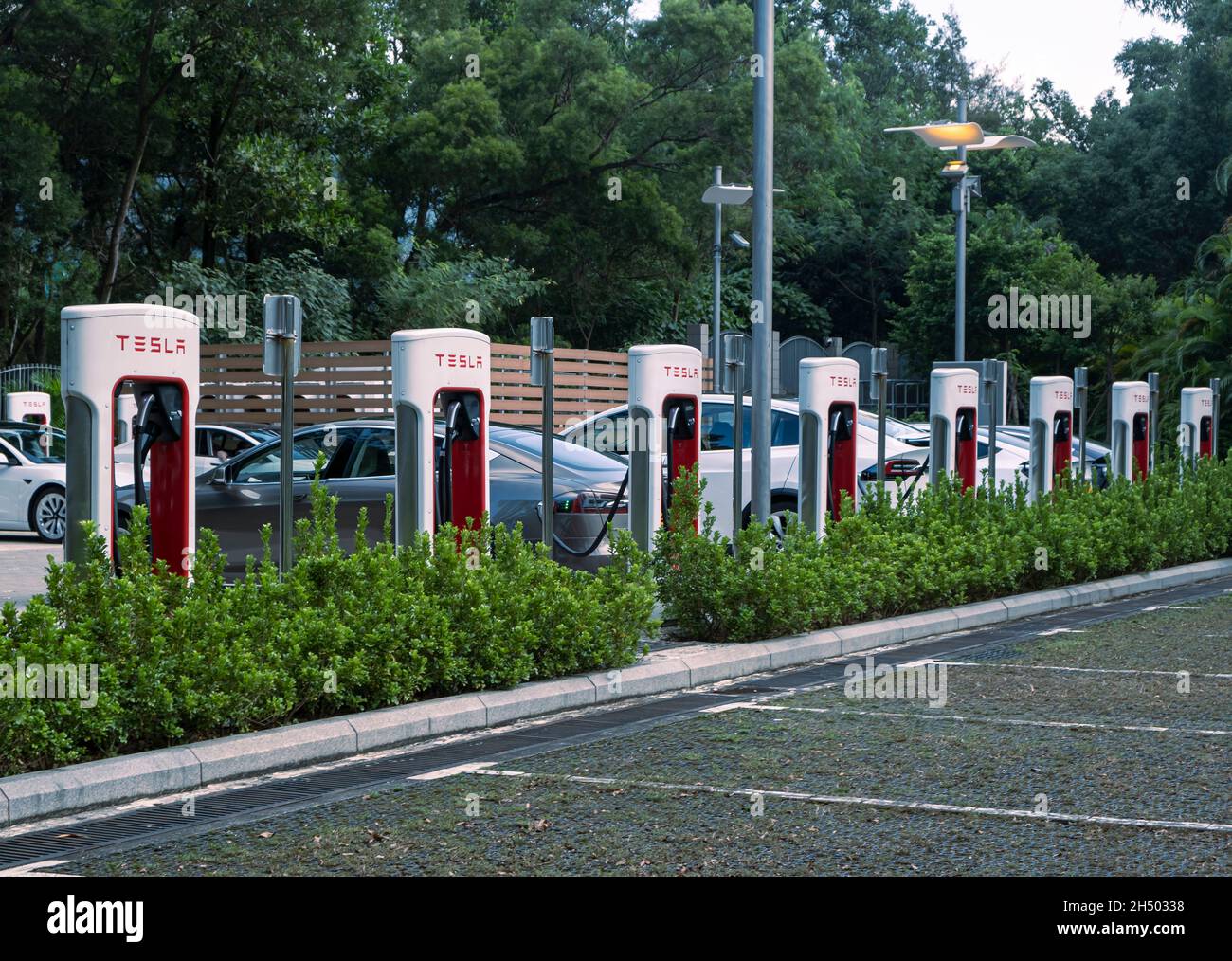 Tesla electric car at the charging station Stock Photo Alamy