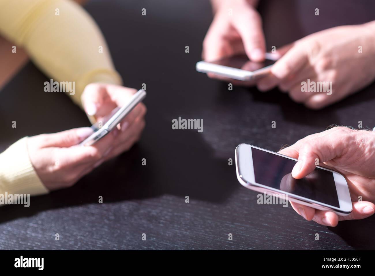 Man Using Many Phones Many people cell phones hi-res stock photography and images - Alamy