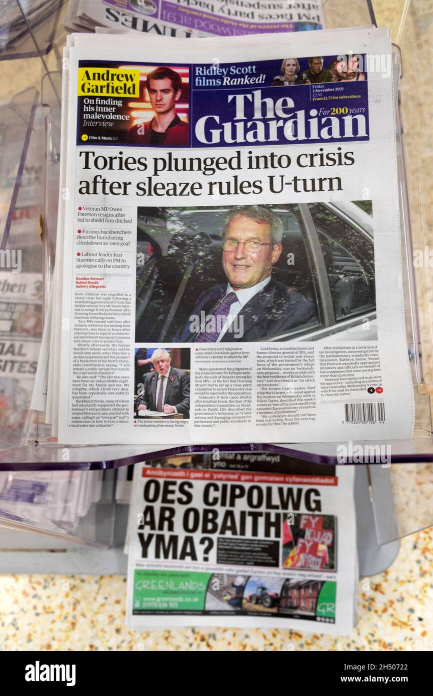 'Tories plunged into crisis after sleaze rules U-turn' The Guardian front page newspaper headline on newsstand 5 November 2021 UK Great Britain Stock Photo