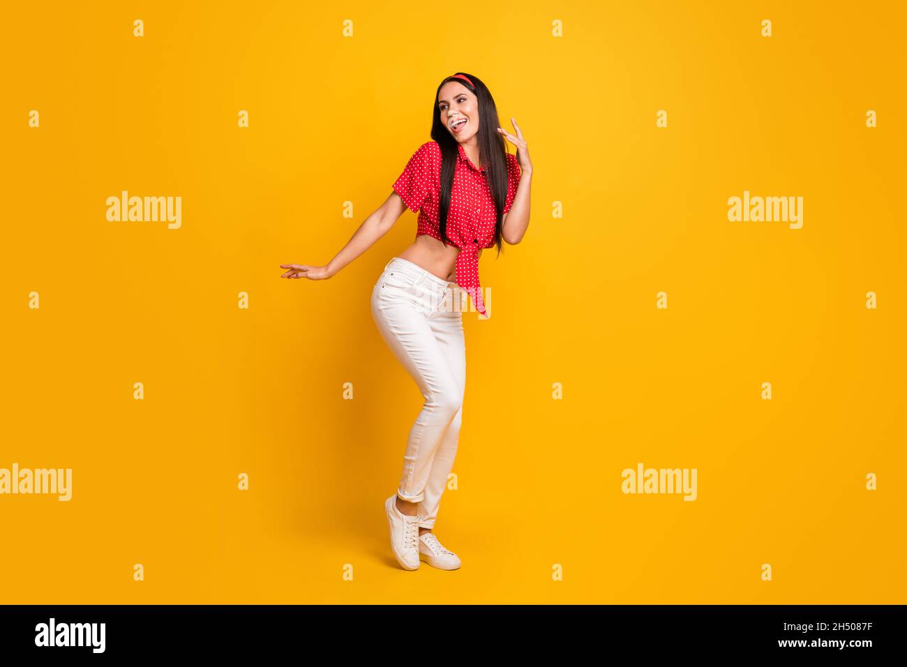 Full length photo of cute adorable young girl dressed red shirt dancing