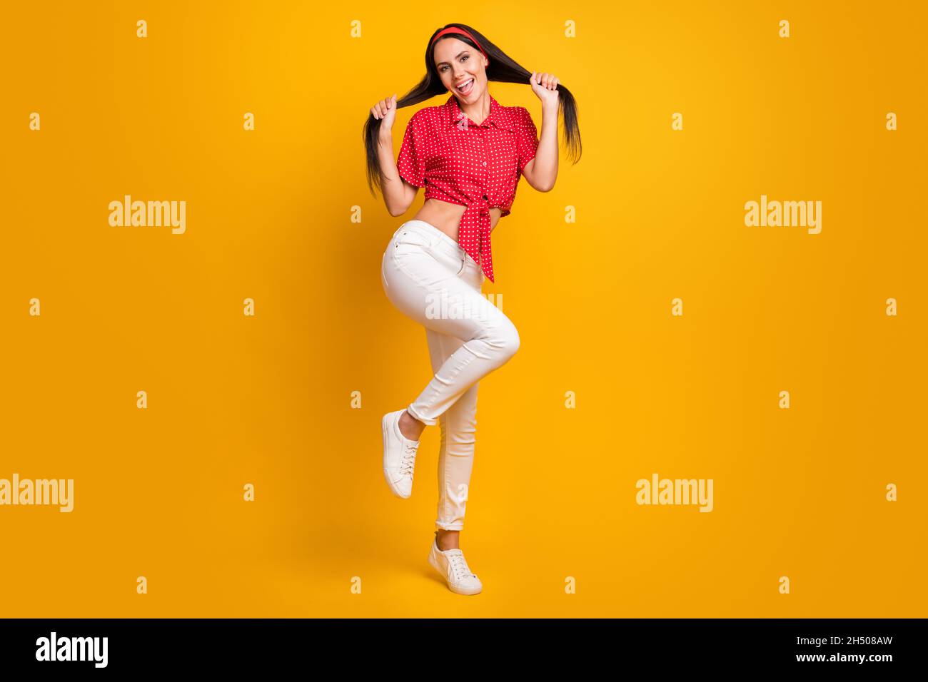 Full length photo of tricky adorable young girl dressed red shirt