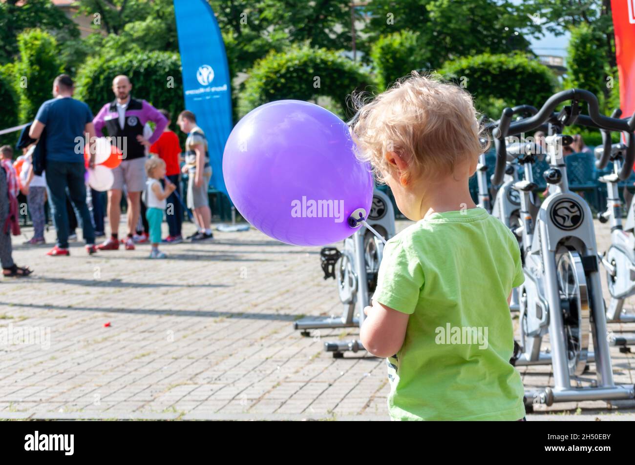 Timisoara, Romania - May 26, 2017: Kid playing with a baloon at a public event Stock Photo