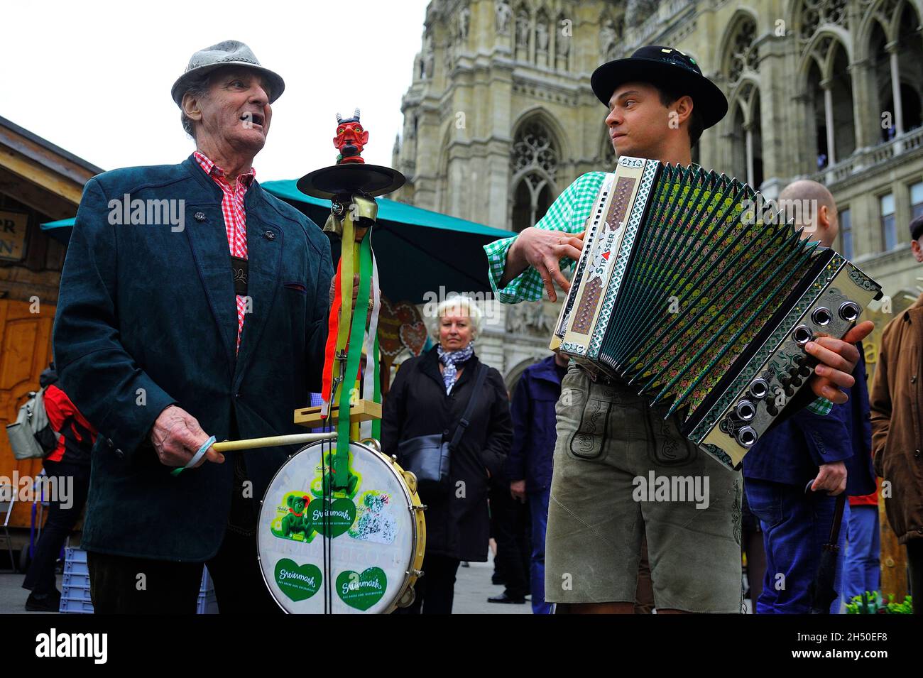 Vienna, Austria. April 12, 2011.  Styria village on Vienna City Hall Square, Two folk musicians with a devil's violin and a button accordion Stock Photo