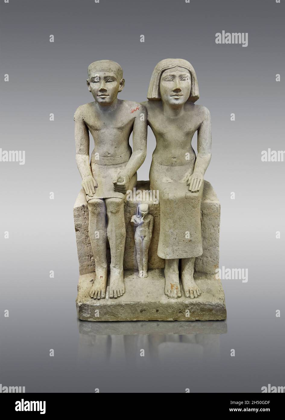 Egyptian statue sculpture of a married couple and son, 2620-2500, 4yj dynasty, limestone. Louvre Museum A44. Stock Photo