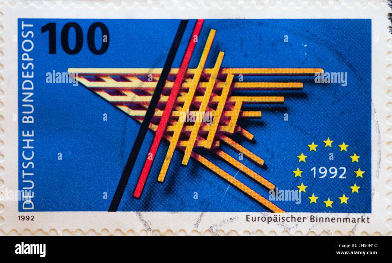 GERMANY - CIRCA 1992 : a postage stamp from Germany, showing the European emblem and five-pointed EU star, made of bars. European single market Stock Photo