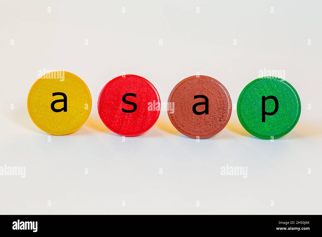 asap is an abbreviation and stands for as soon as possible. The letters stand on colorful toy wooden building blocks Stock Photo