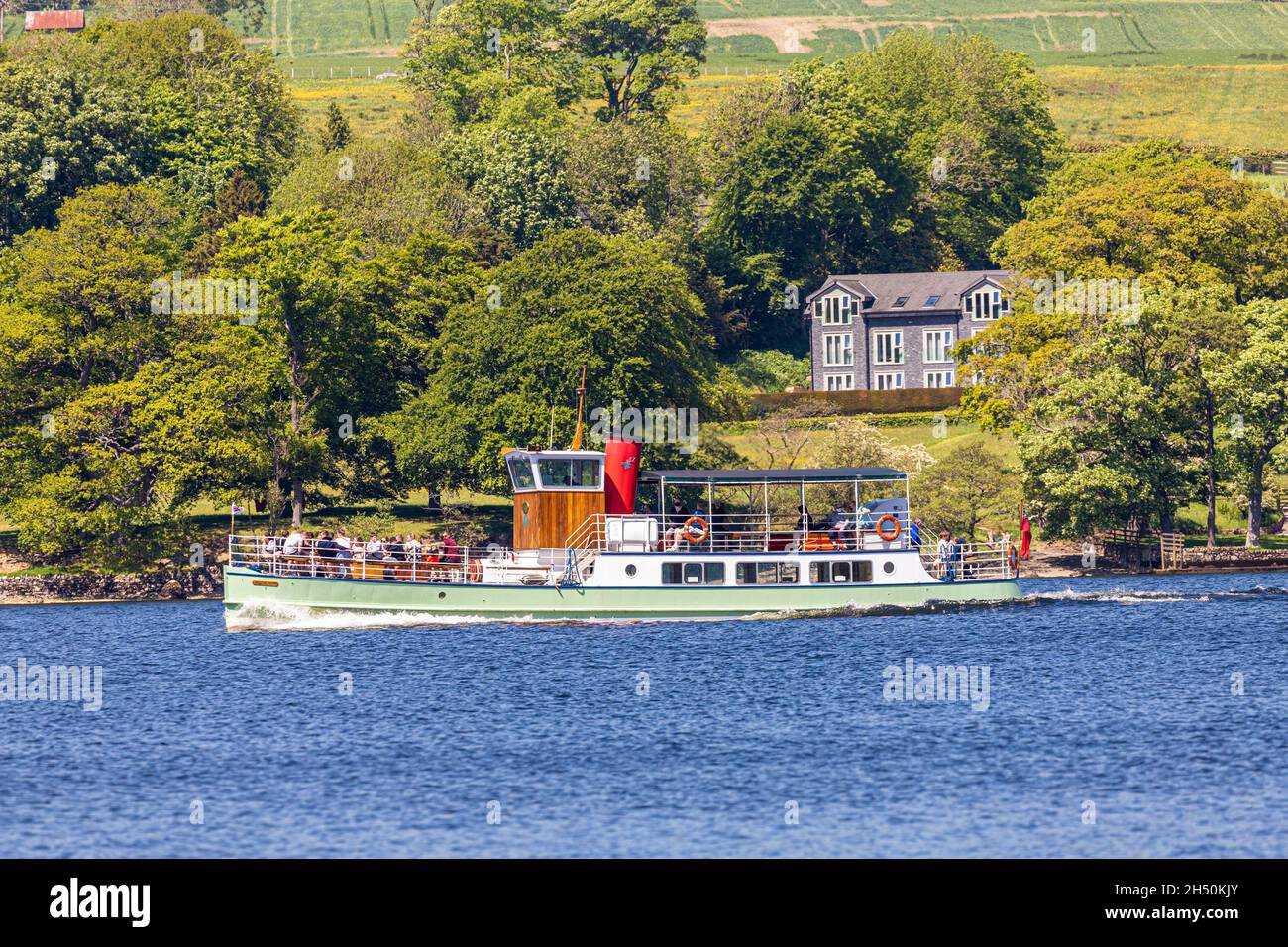 Western Bell, one of the Ullswater Steamers, passing Watermillock in the English Lake District, Cumbria UK Stock Photo