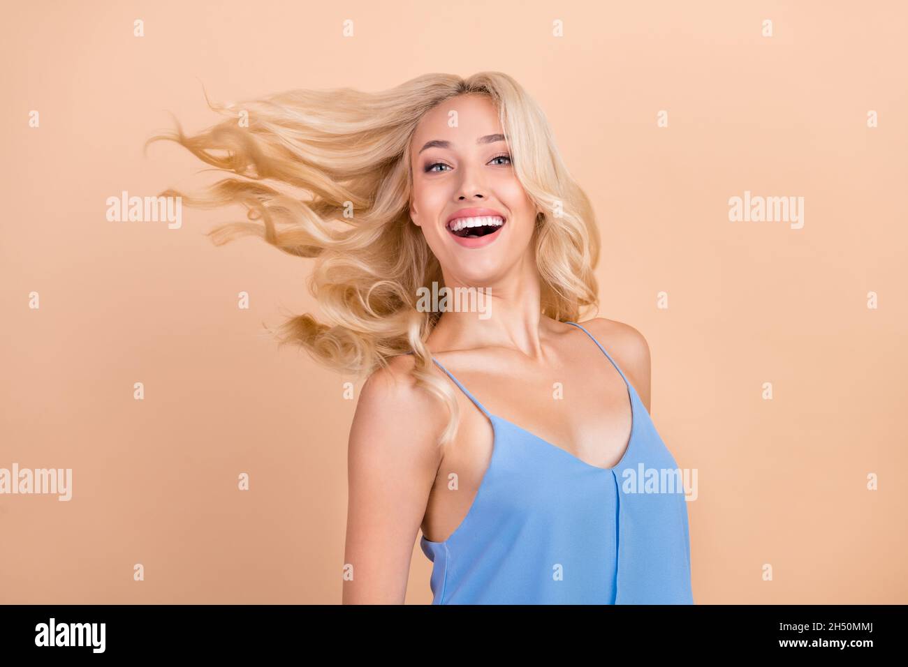 Photo of young attractive woman happy positive smile fly air wind hair ...
