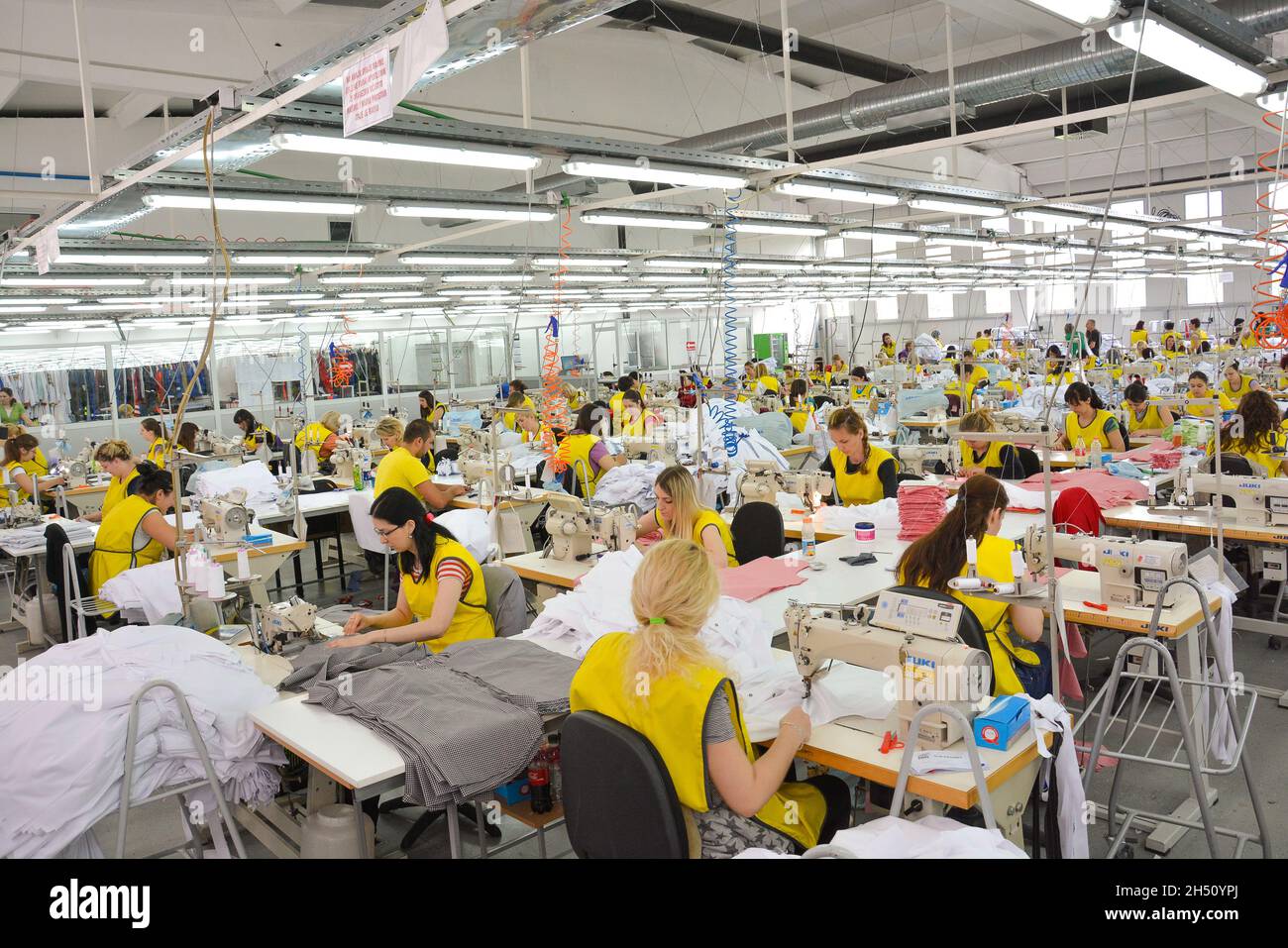 Large textile factory with valuable workers Stock Photo