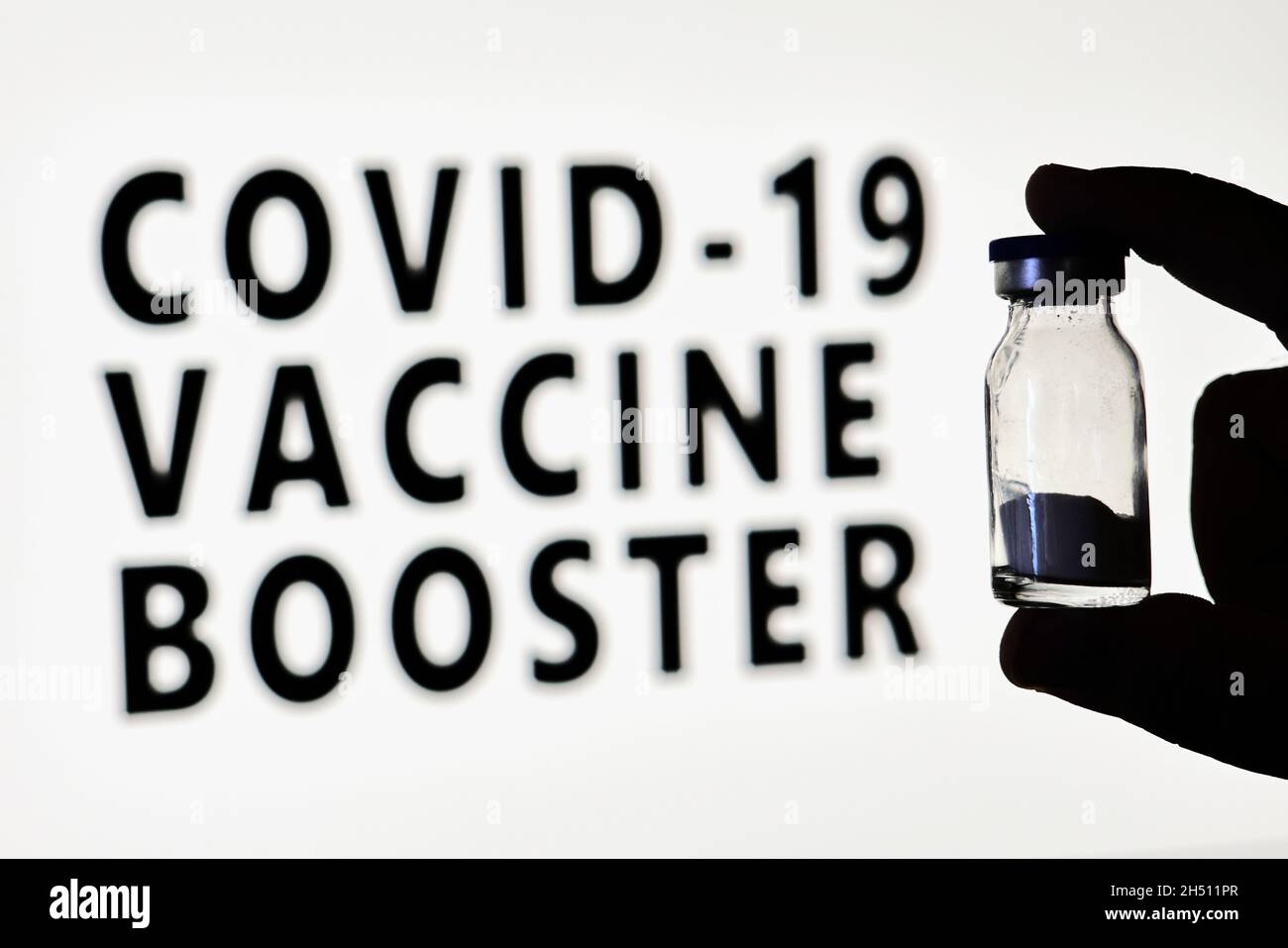 Finding Booster Covid-19 Vaccine booster dose. Hand of the doctor holds a new Covid ...