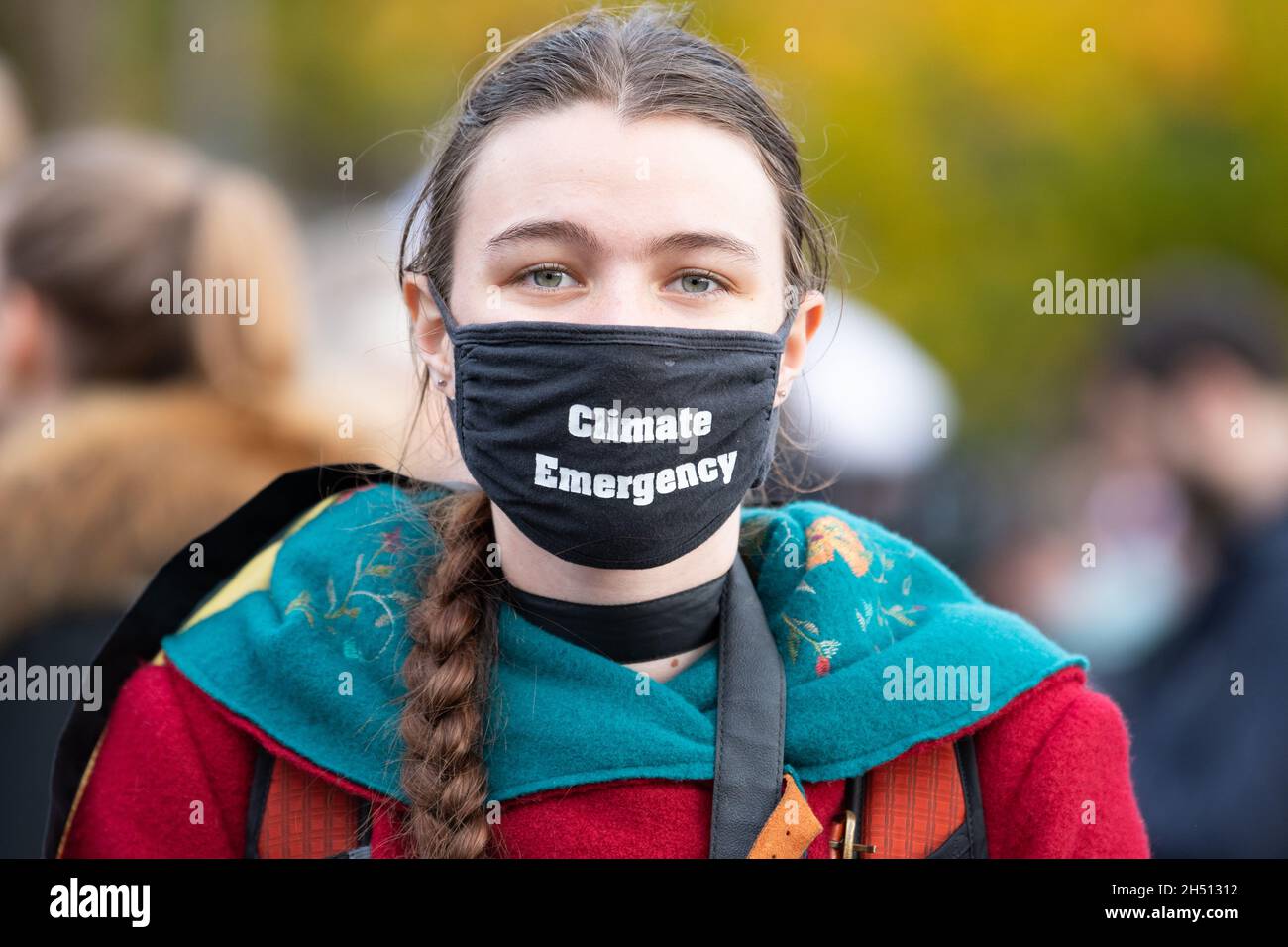 Glasgow, Scotland, UK. 5th Nov, 2021. Youth Climate Activist March and speeches organised by Fridays for Future Scotland during the COP26 UN climate change conference. Pictured: Young activist wearing a 'climate emergency' face mask just before the start of the march from Kelvingrove Park to George Square Credit: Kay Roxby/Alamy Live News Stock Photo