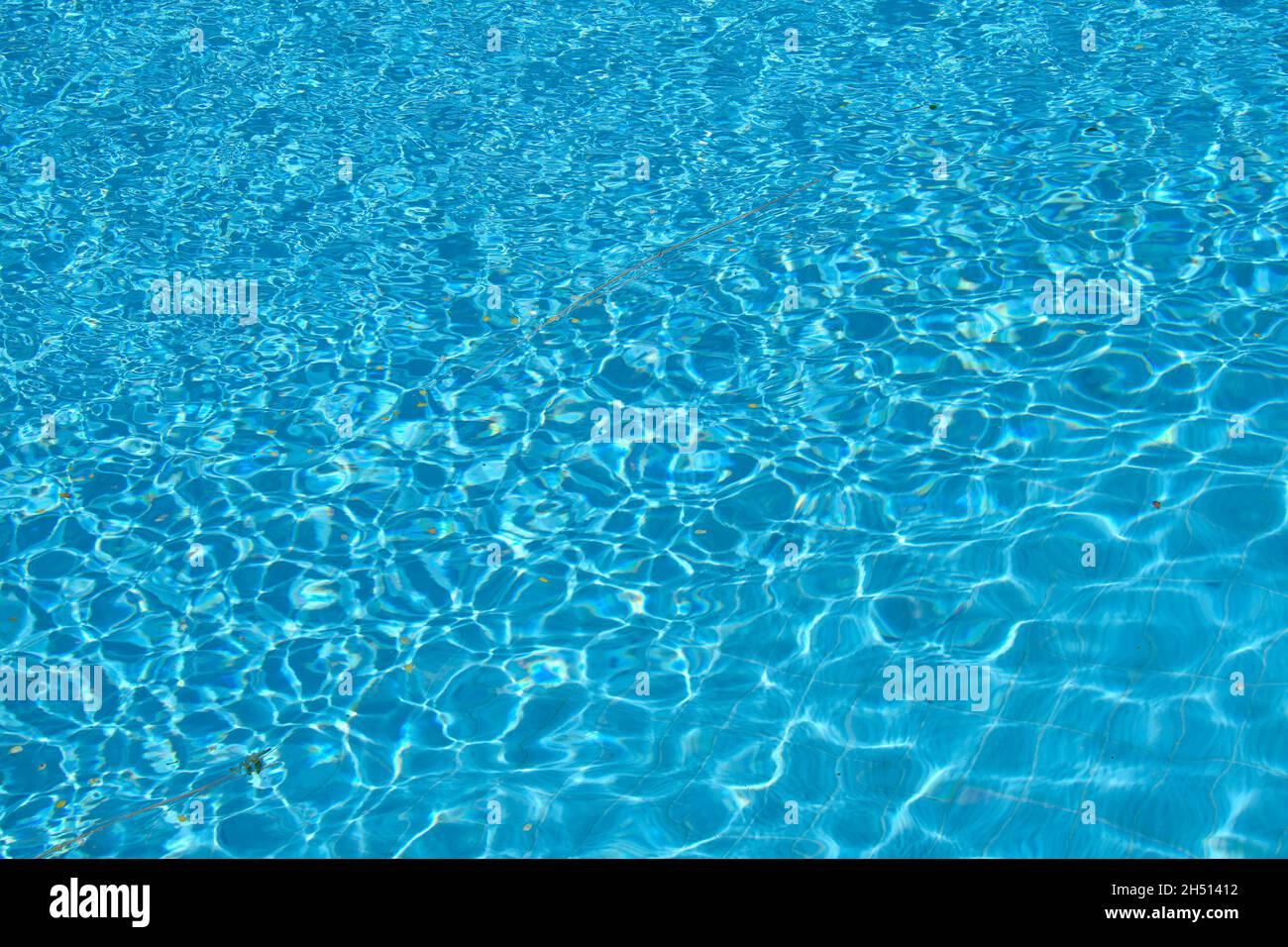 Closeup surface of blue clear water with small ripple waves in swimming ...