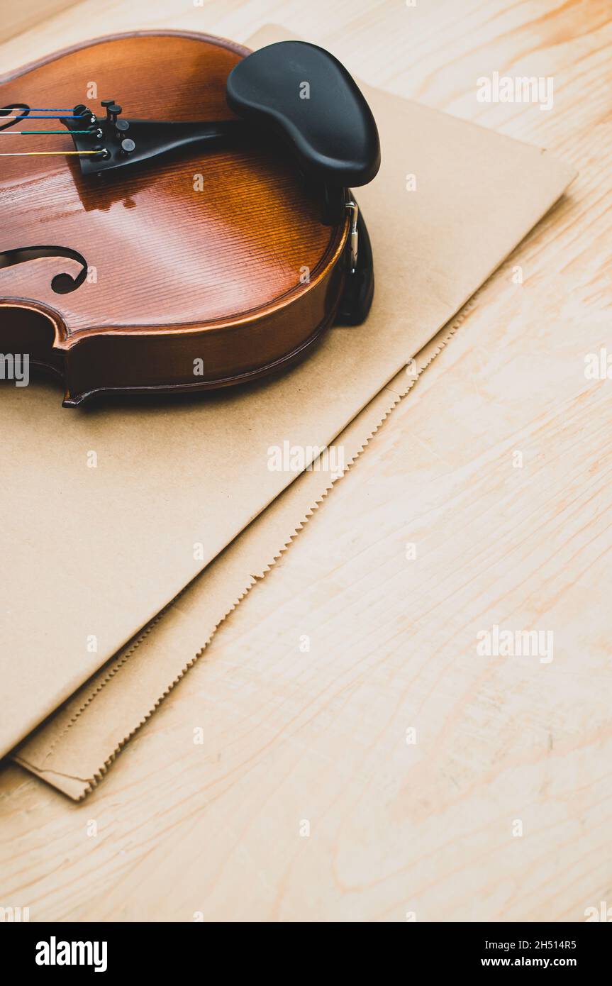Volin Paper fine acoustic violin on a brown paper and wooden background Stock Photo ...