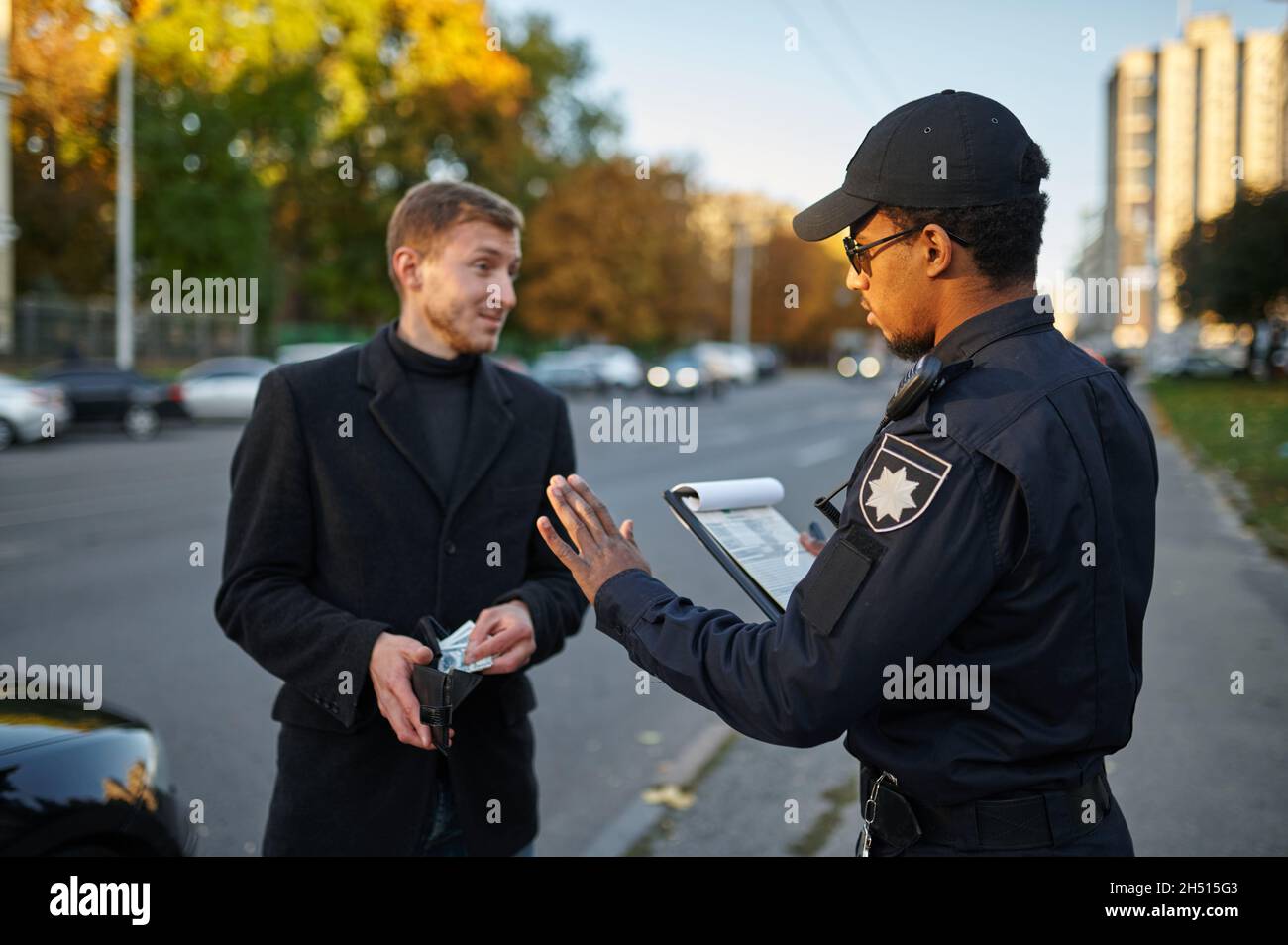 Police officer refuses to take a bribe from driver Stock Photo Alamy