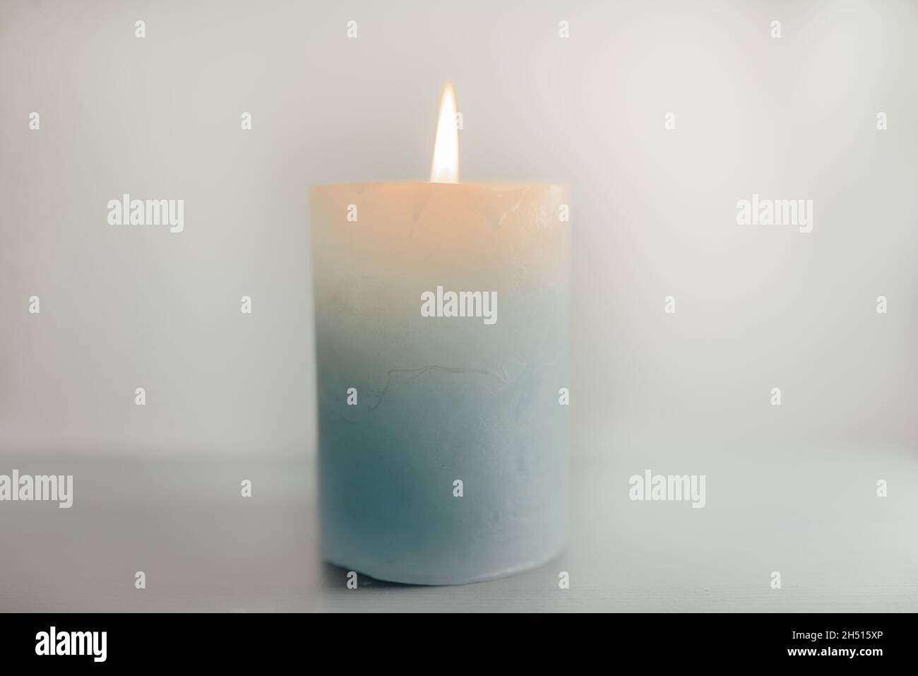 Burning candle placed on a table. Meditation Stock Photo Alamy