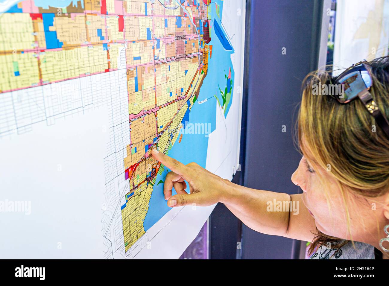 Miami Florida,Riverside Center centre,GIS Day,Geographic Information Systems,map Hispanic woman female zoning Stock Photo