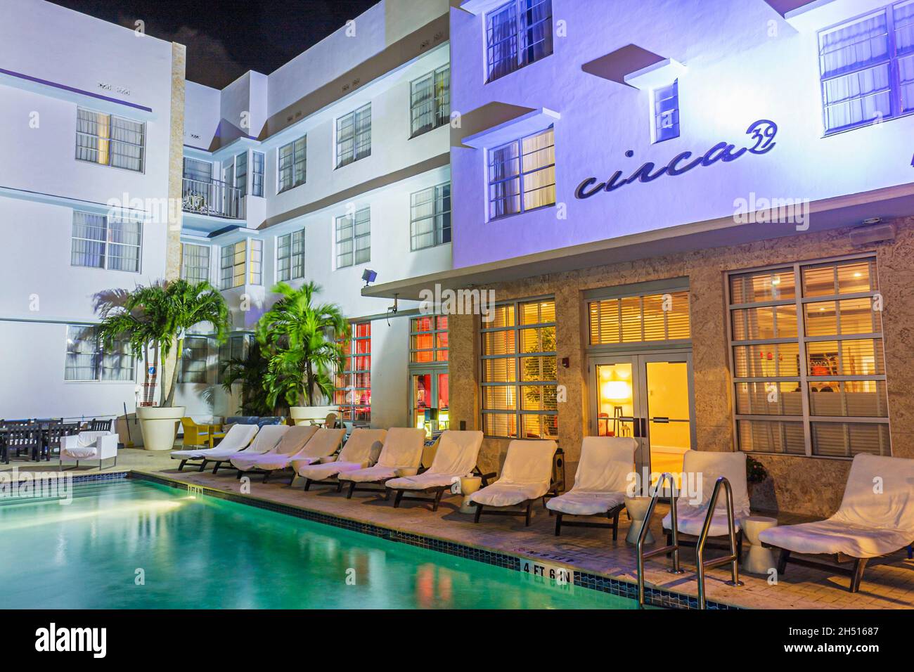 Miami Beach Florida,Collins Avenue,Circa 39 hotel,boutique art deco style swimming pooldeck lounge chairs night property Stock Photo