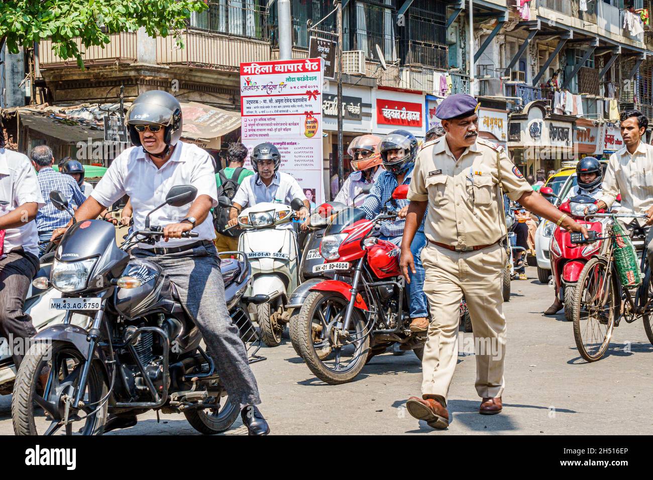 Mumbai India,Tardeo,Jehangir Boman Behram Road,traffic officer policeman polic motorcycles motor scooters busy Stock Photo
