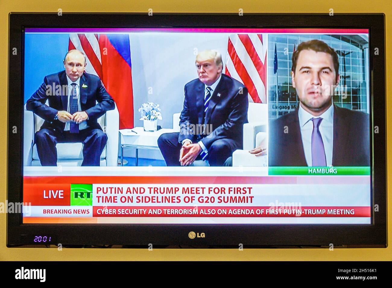 Porto Portugal,television screen tv monitor flat panel,RT Russia Today channel program,breaking news,Donald Trump Vladimir Putin reporter Stock Photo