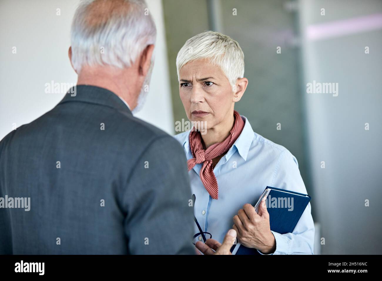 senior busniess people talking office angry argument Stock Photo