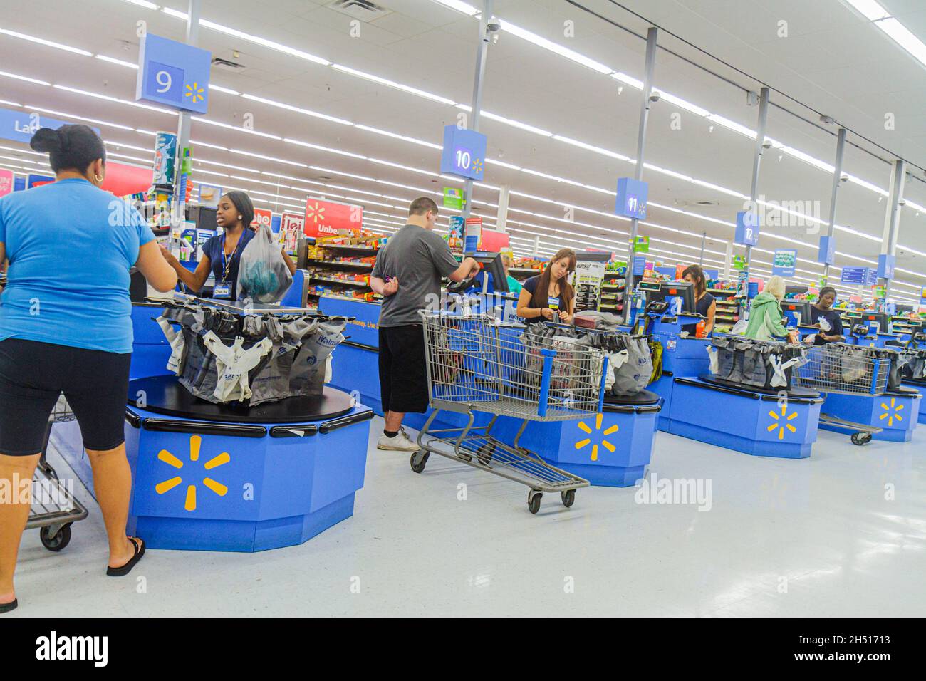 Naples Florida,Walmart Big-Box discount,shopping shoppers market marketplace store checkout line queue cashier cashiers customer employees workers Stock Photo