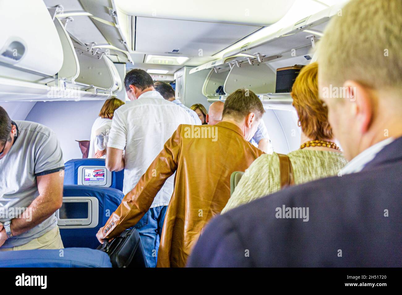 Atlanta Georgia,Hartsfield Jackson Atlanta International Airport,Delta Airlines men male,aisle passengers exiting arrival disembarking leaving cabin Stock Photo