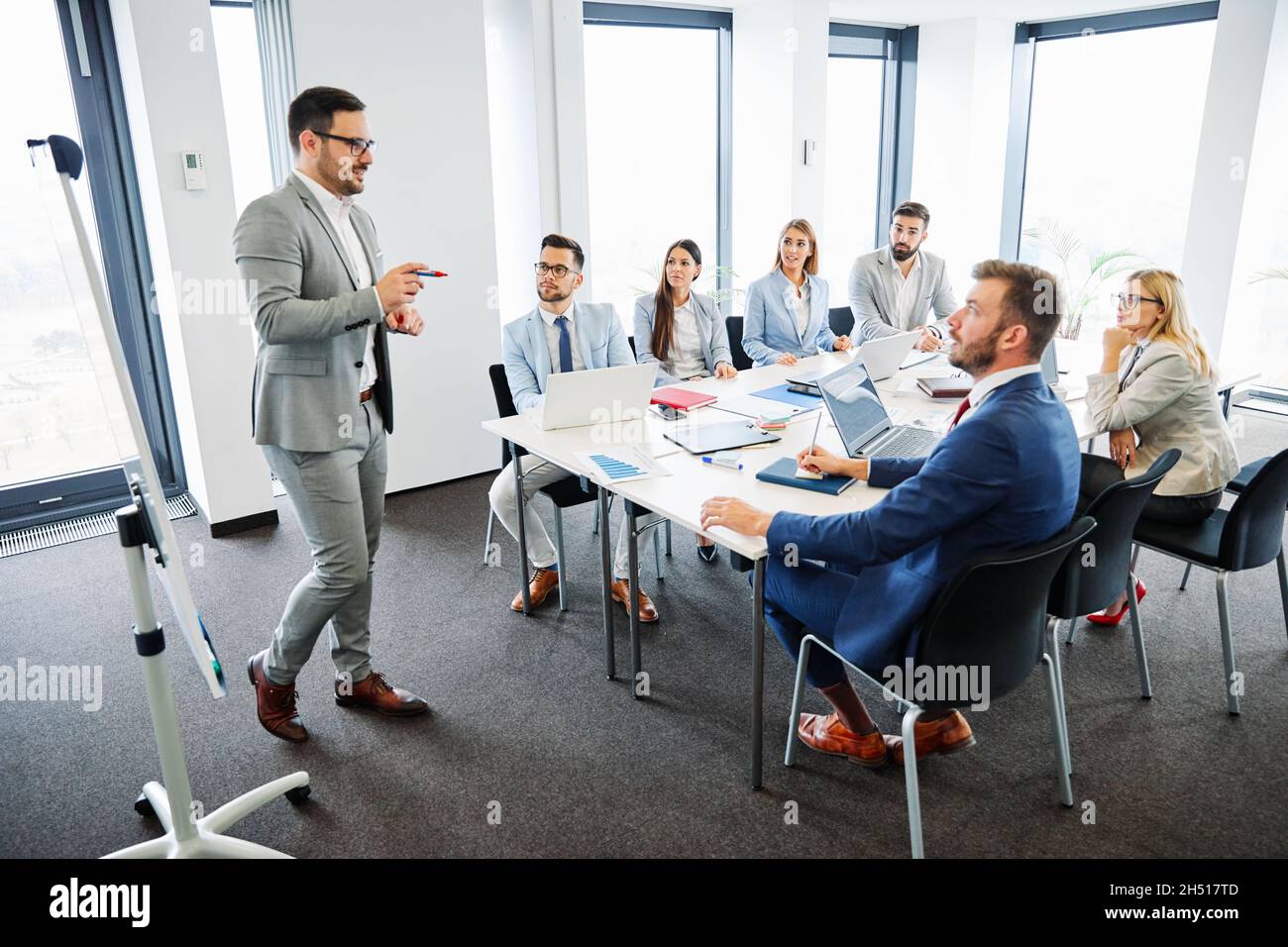 young business people meeting office whiteboard team colleague Stock