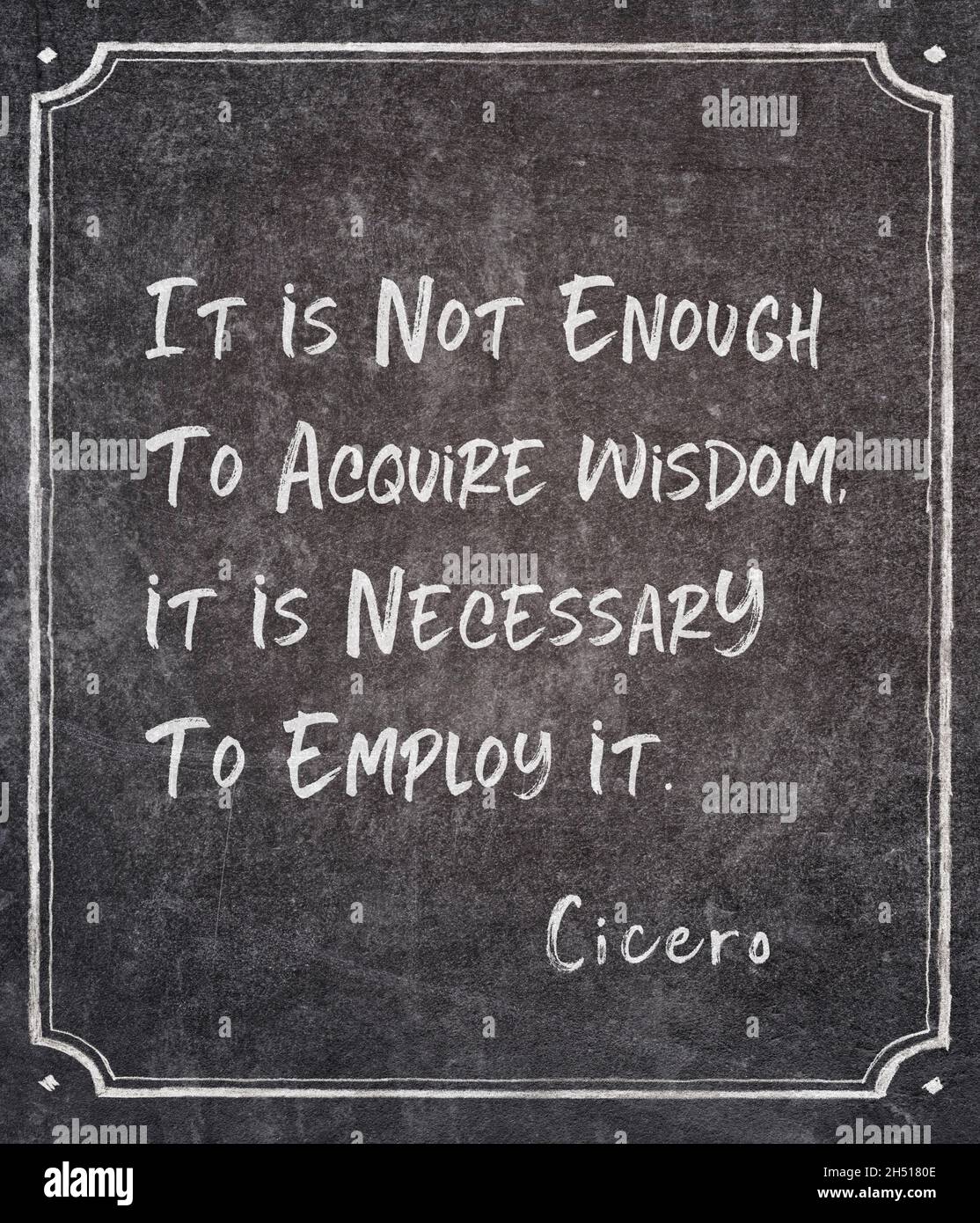 It is not enough to acquire wisdom, it is necessary to employ it - ancient Roman philosopher Cicero quote written on framed chalkboard Stock Photo