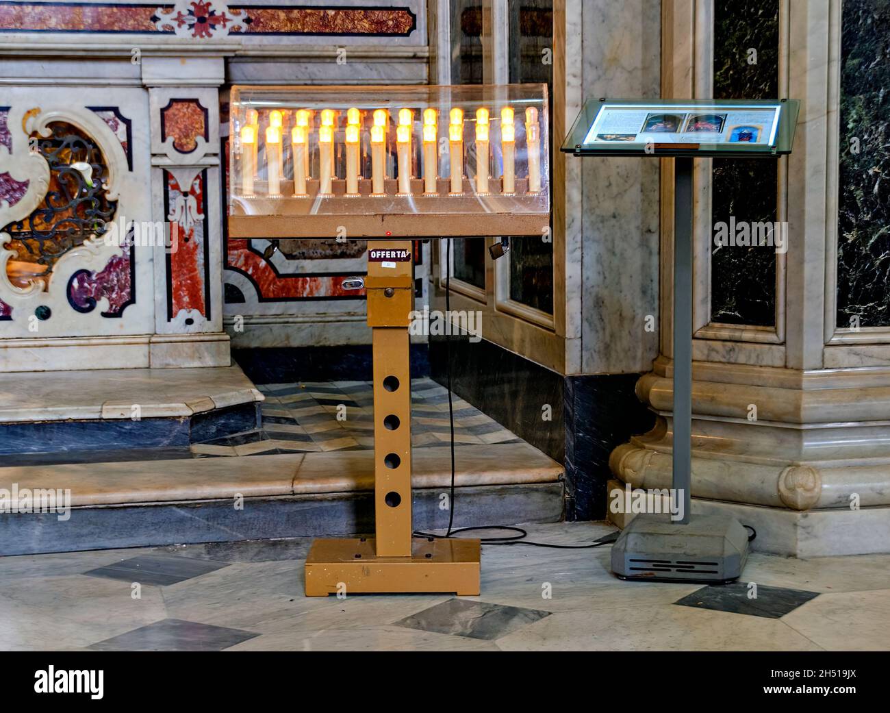 electric votive candles in a church at Altamura, Italy Stock Photo Alamy