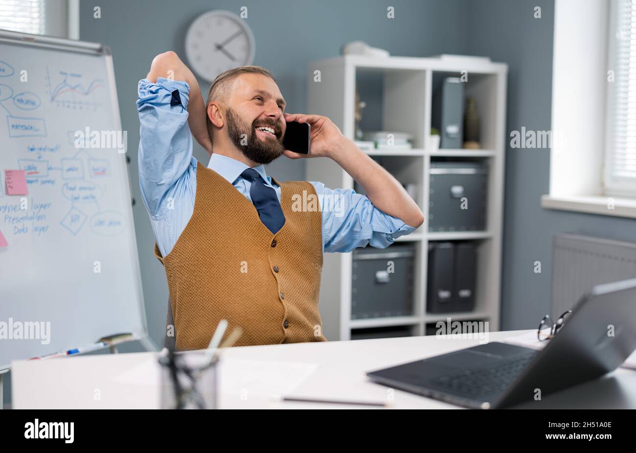 Businessman using laptop and mobile Stock Photo